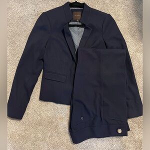 Navy textured suit with gold detail buttons